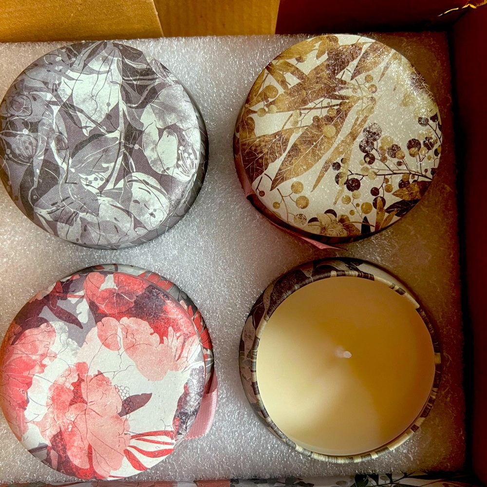 New scented of 4 candle set with natural ingredients the box is damaged